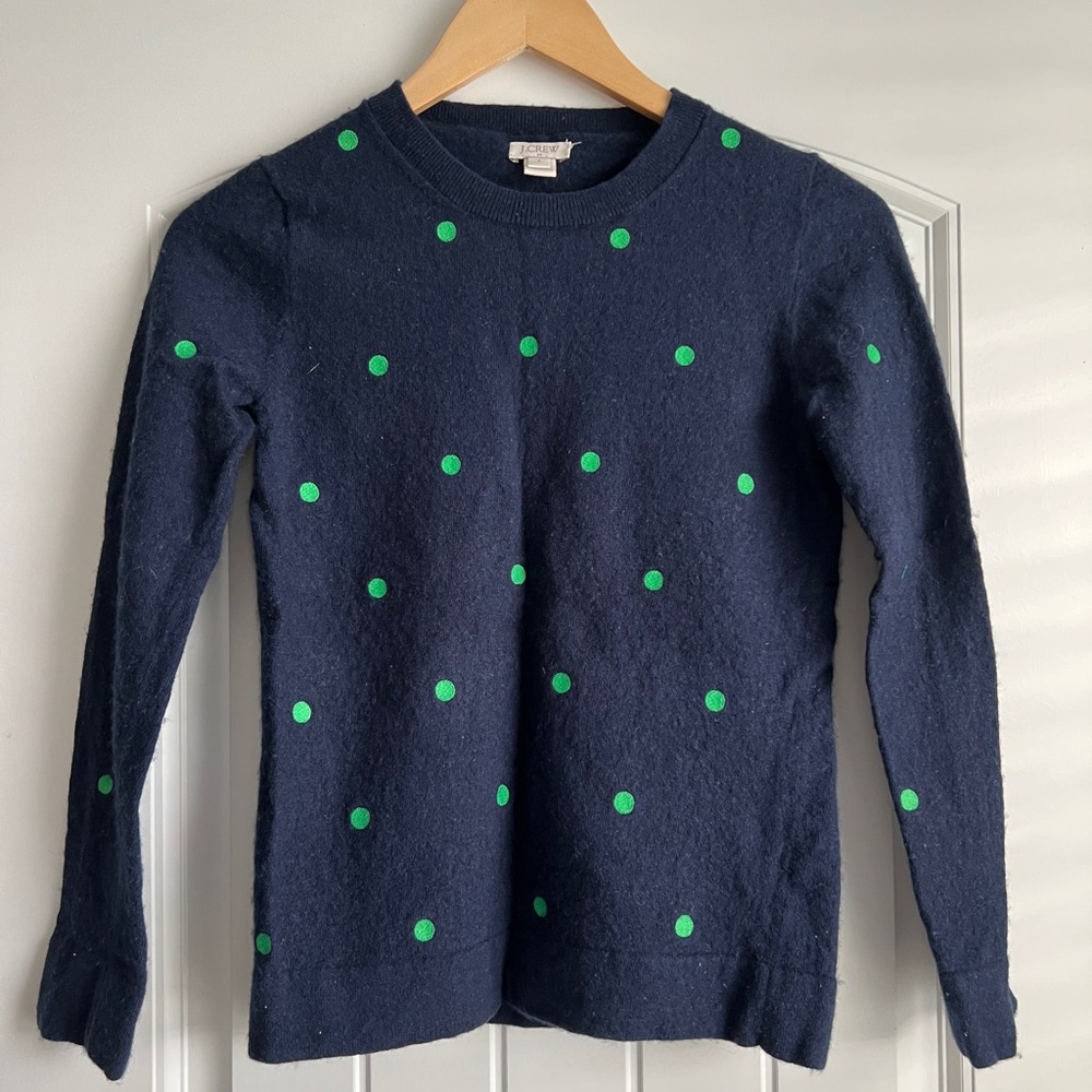 J. Crew crew neck sweater in navy blue with green polka dots.